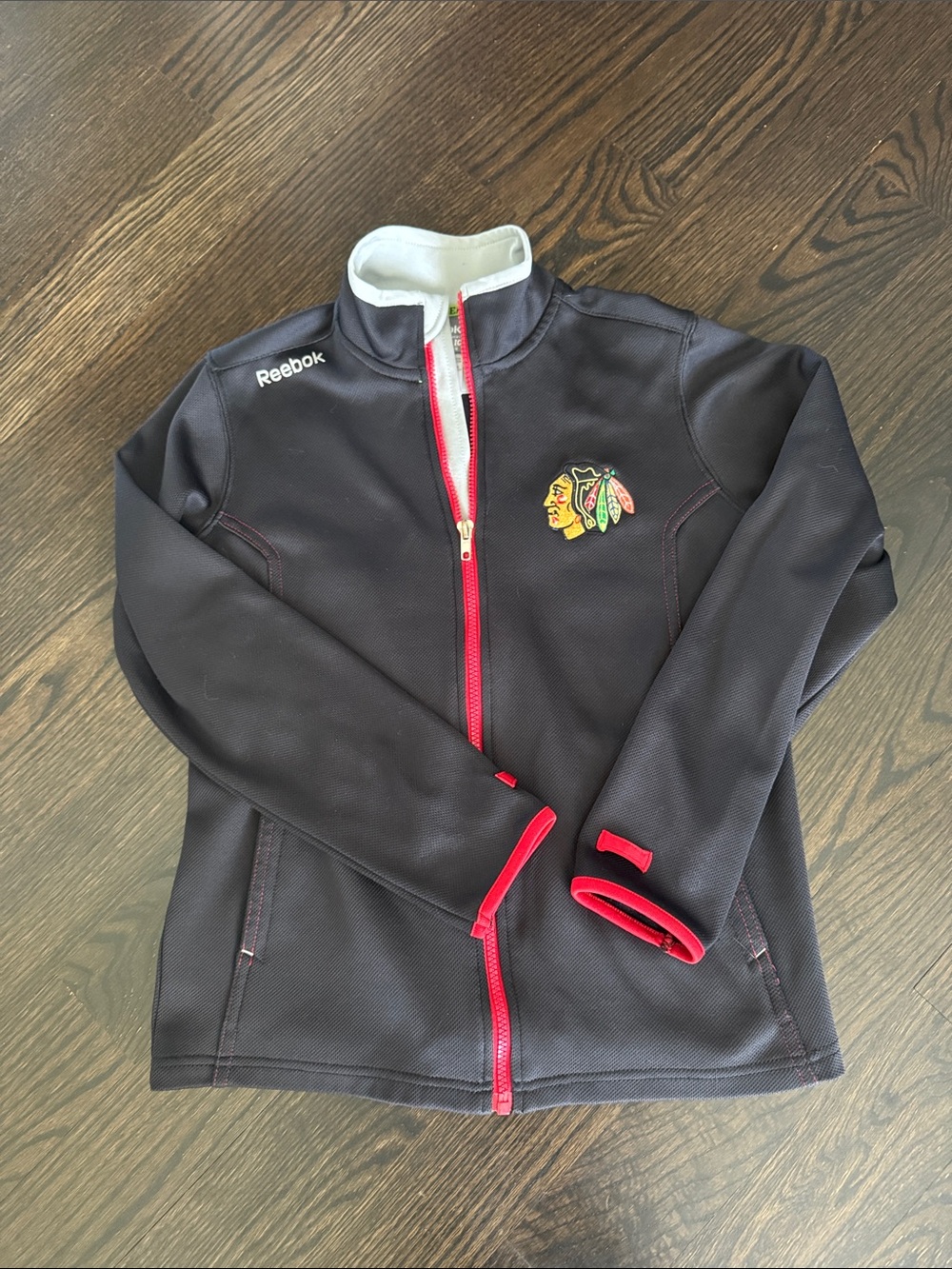 Boys Reebok Black Jacket with Red Trim and Blackhawks Crest